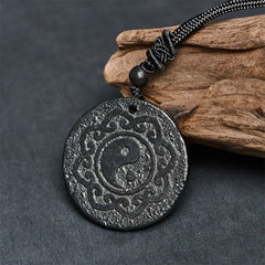 Shungite Yin Yang Pendant – styled on driftwood prop, EMF protection amulet