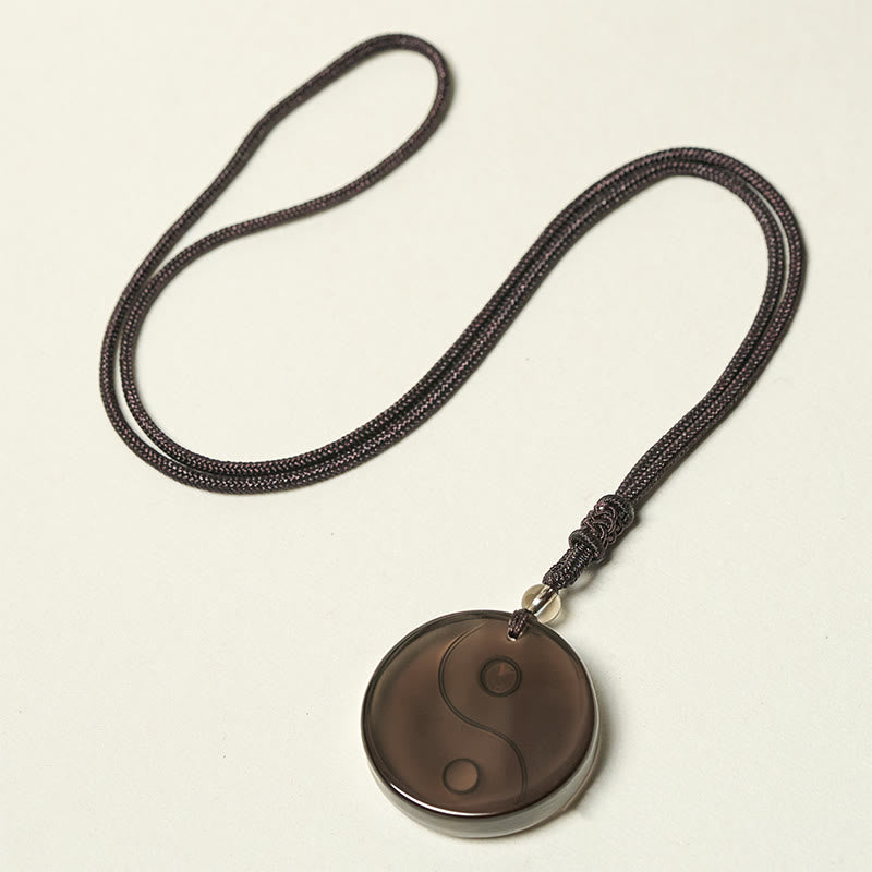 Ice Obsidian Yin Yang Pendant – full necklace flat lay, obsidian yin yang amulet