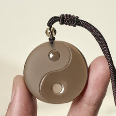 Ice Obsidian Yin Yang Pendant – close-up hand-held detail, polished obsidian jewelry
