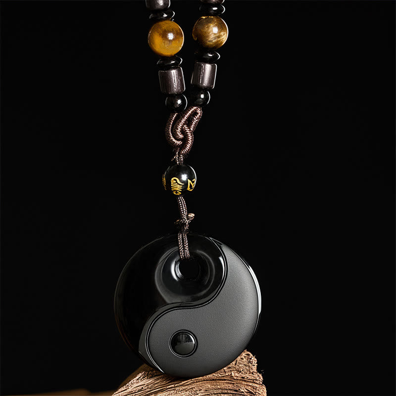 Black Obsidian Yin Yang Necklace front view, gold inscribed bead, spiritual pendant