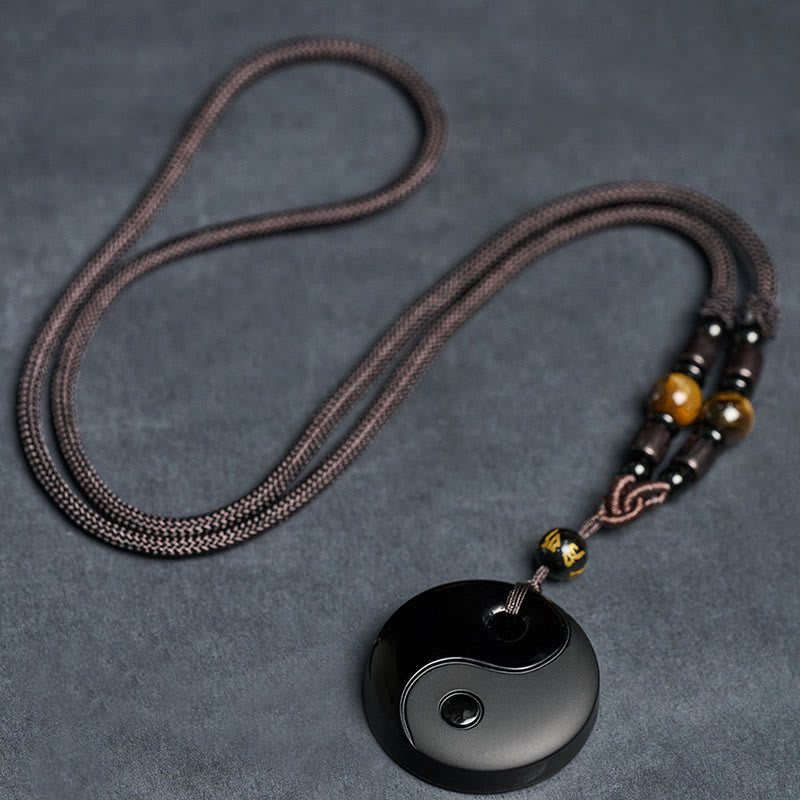 Full Yin Yang Obsidian Necklace flat lay, tiger's eye beads, macrame cord, spiritual jewelry
