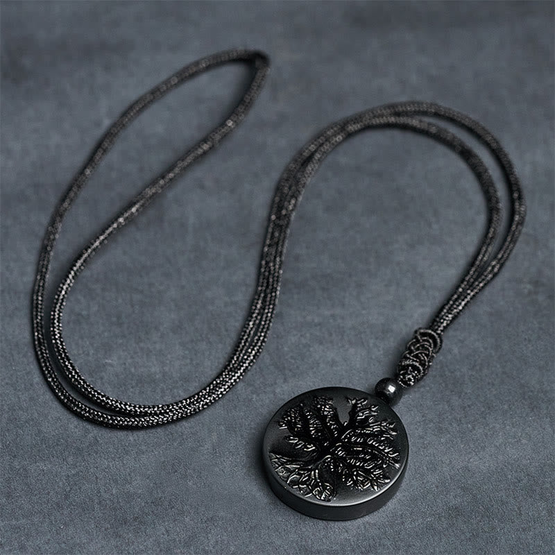 Tree of Life Black Obsidian Necklace – full length cord necklace laid flat on gray surface, mens necklace