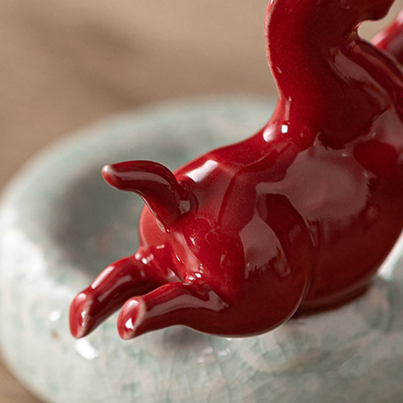 Year of the Horse Incense Burner – Close-up of red glaze tail detail on crackle celadon base