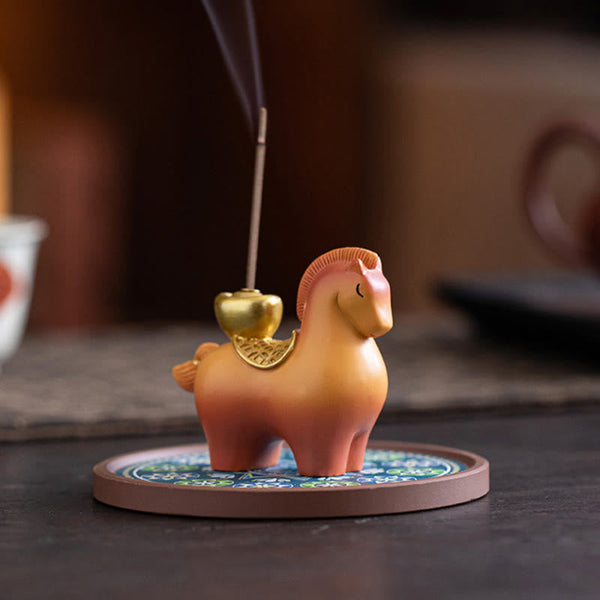 Year of Horse Ingot Incense Burner – Peach-gold horse with gold heart-shaped cup on blue enamel base, rising smoke, incense burner