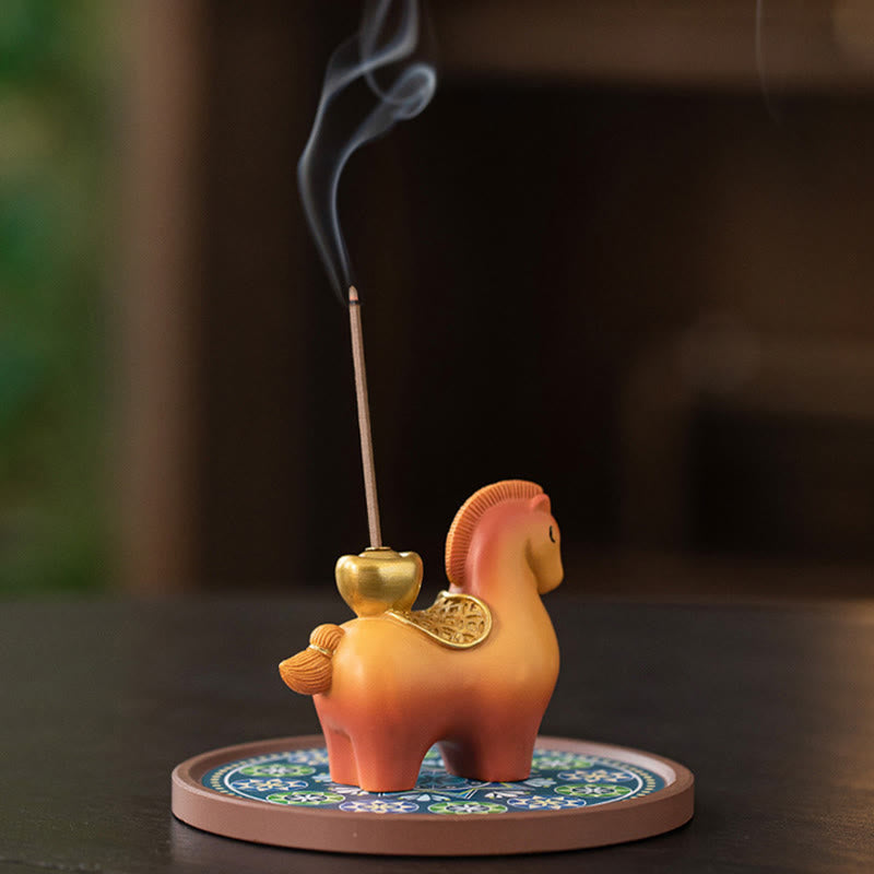 Year of Horse Ingot Incense Burner – Orange horse with gold filigree wings and yuanbao holder, lit incense with smoke, incense burner