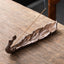 Peacock Shape Ceramic Incense Burner – Two peacock feather holders in teal and bronze with gold eye patterns, one lit, ceramic incense holder