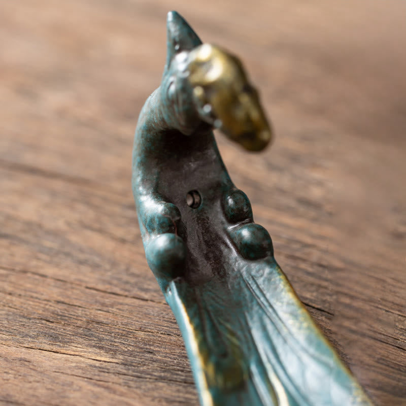 Peacock Shape Ceramic Incense Burner – Teal ceramic holder with gold crackle glaze and curved neck detail on wooden surface, incense holder