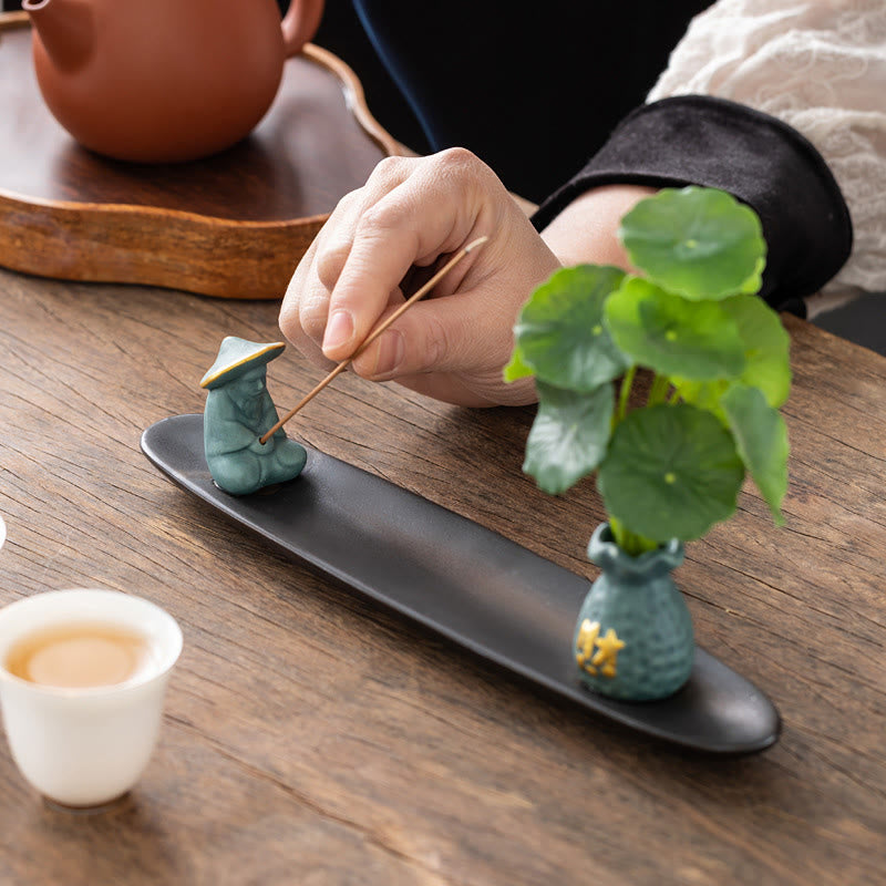 Pixiu Wealth Ceramic Incense Burner – hand placing incense stick, tea ceremony setup zen