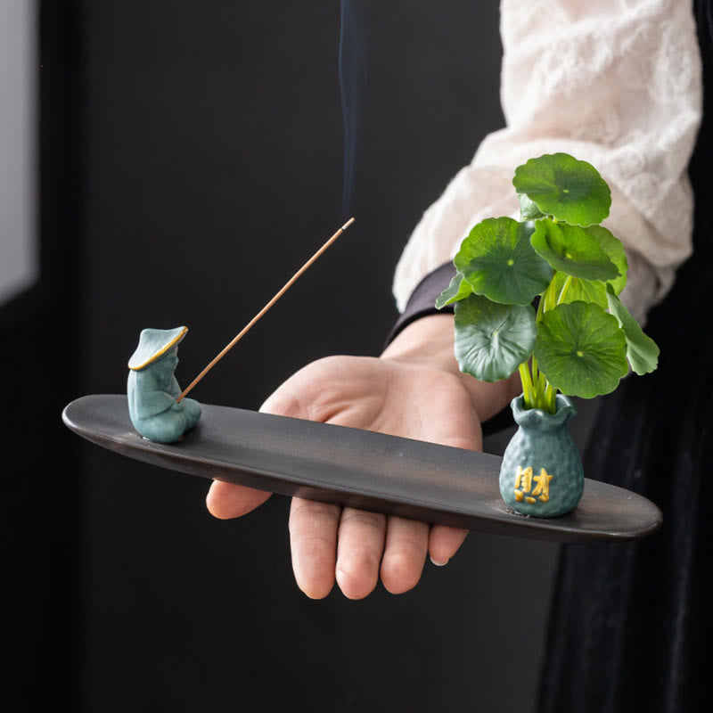 Pixiu Wealth Ceramic Incense Burner – hand holding blue fisherman plate, portable zen decor