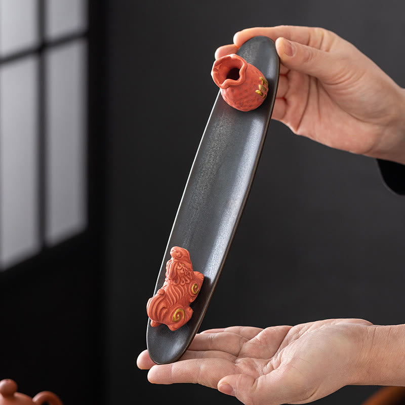 Pixiu Wealth Ceramic Incense Burner – hands holding pink Pixiu tray, size demonstration