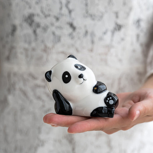 Panda Ceramic Incense Burner - Panda figurine cradled in hand showing palm size, harmony decor
