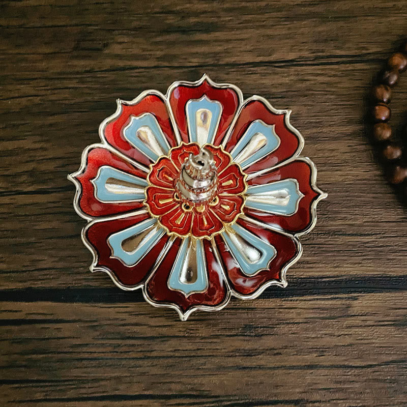 Lotus Home Decoration Incense Burner – Red blue enamel petals, gold trim, top view on dark wood, Meditative