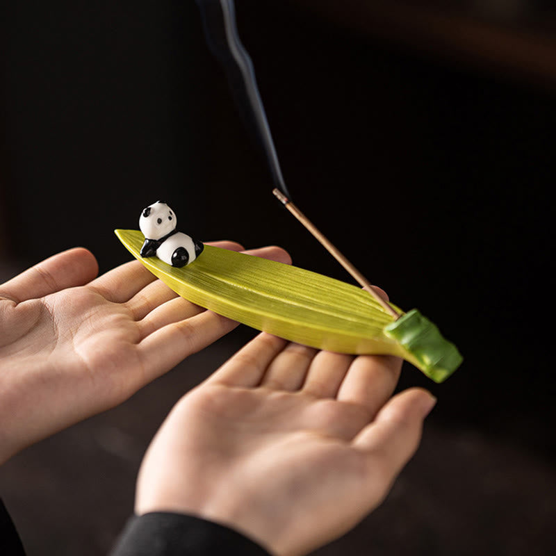 Panda Ceramic Incense Burner - Green leaf panda holder cradled in hands with smoke, zen decor