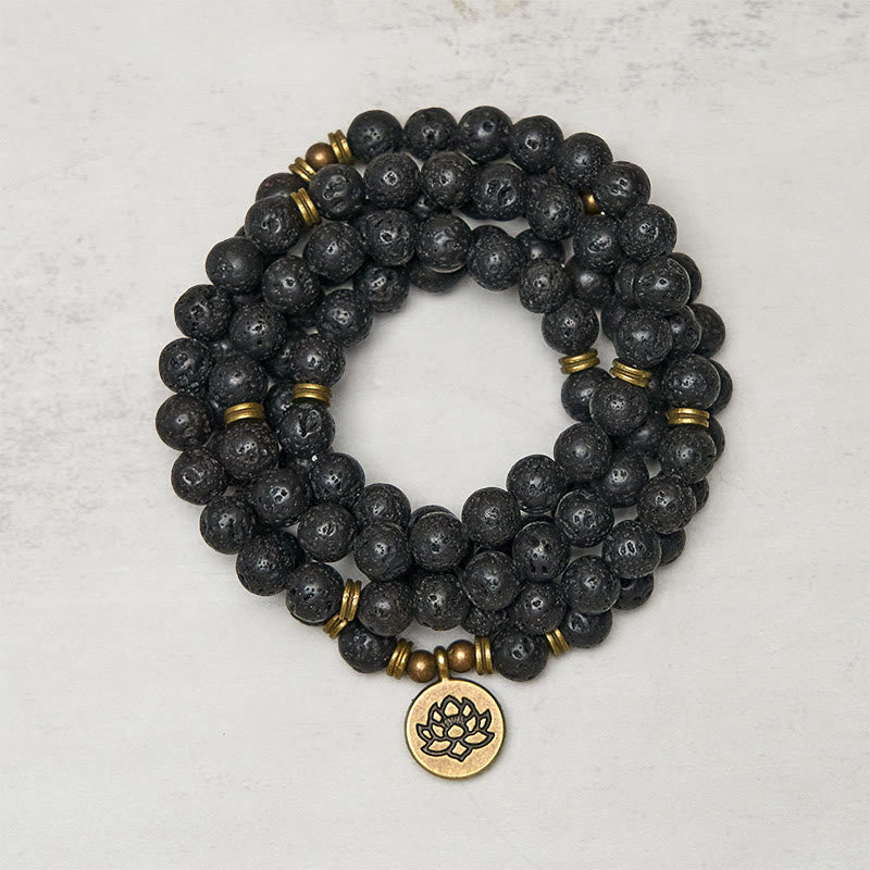 Lava Rock Lotus Healing New Beginning Mala – coiled black lava beads with brass lotus pendant, Grounding