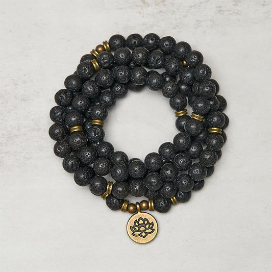 Lava Rock Lotus Healing New Beginning Mala – coiled black lava beads with brass lotus pendant, Grounding