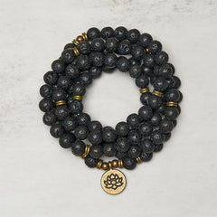 Lava Rock Lotus Healing New Beginning Mala – coiled black lava beads with brass lotus pendant, Grounding