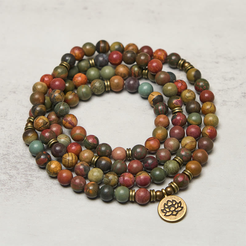 Red Turquoise Lotus Warm Mala – wrapped red turquoise beads with rust and green patterns, Earthy