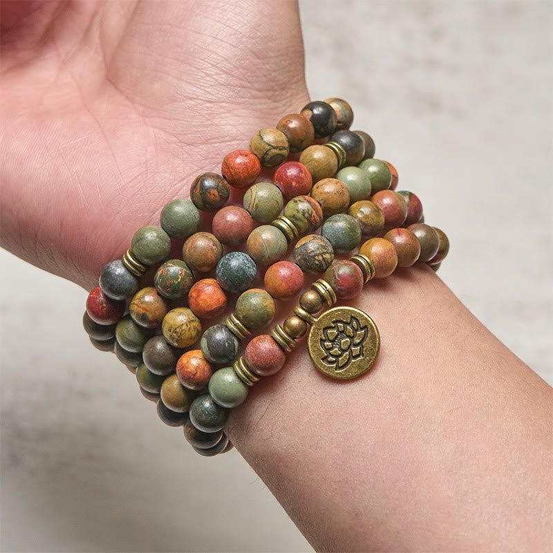 Red Turquoise Lotus Warm Mala – multi-wrap red turquoise bracelet on wrist with lotus charm, Vibrant