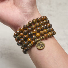 Tiger Eye Lotus Beaded Strength Mala – multi-wrap tiger eye bracelet on wrist with lotus charm, Bold