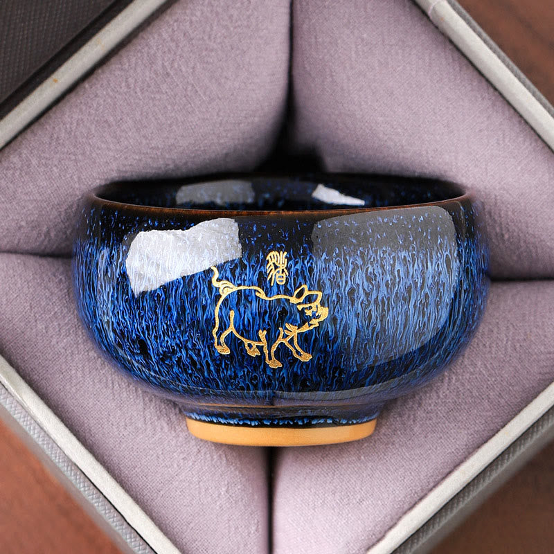 Ceramic Horse Zodiac Cup – Gold pig on blue oil-spot glaze, top-down view, abundant