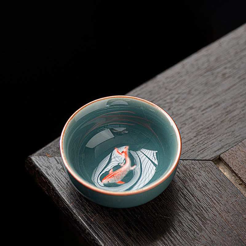 Hand Painted Koi Fish Ceramic Teacup – celadon cup with orange koi on dark wood, gongfu tea cup 50ml