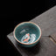 Hand Painted Koi Fish Ceramic Teacup – celadon cup with orange koi on dark wood, gongfu tea cup 50ml