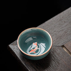 Hand Painted Koi Fish Ceramic Teacup – celadon cup with orange koi on dark wood, gongfu tea cup 50ml