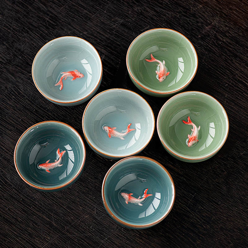 Hand Painted Koi Fish Ceramic Teacup – group of celadon cups with koi fish detail, handmade gongfu cups