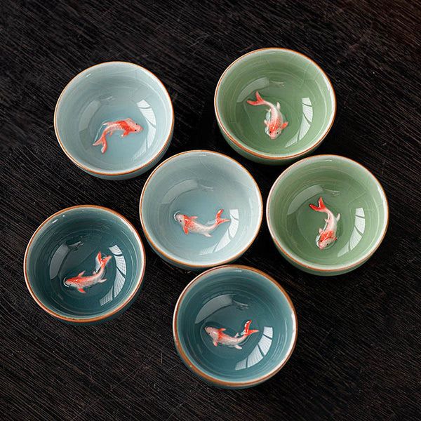 Hand Painted Koi Fish Ceramic Teacup – group of celadon cups with koi fish detail, handmade gongfu cups