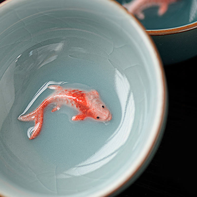 Hand Painted Koi Fish Ceramic Teacup – two color variant cups in hands showing koi fish, gongfu tea ware