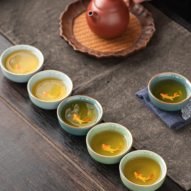 Hand Painted Koi Fish Ceramic Teacup – five cups in crescent with teapot, koi visible through green tea