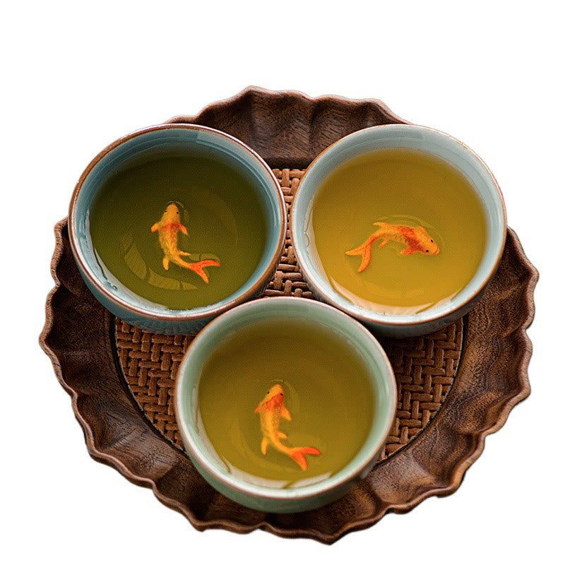 Hand Painted Koi Fish Ceramic Teacup – macro detail of painted koi fish inside celadon cup, artisan ware