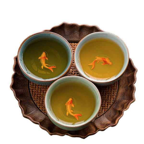 Hand Painted Koi Fish Ceramic Teacup – macro detail of painted koi fish inside celadon cup, artisan ware