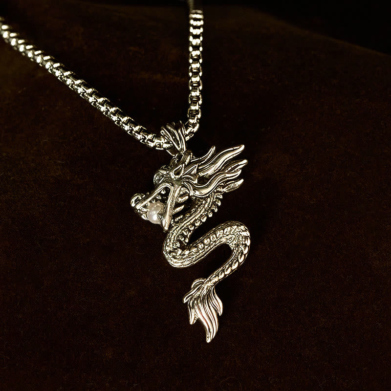 Copper Dragon Necklace – Pearl-clutching dragon on dark backdrop, spotlight, powerful