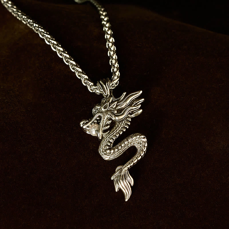 Copper Dragon Necklace – Coiled dragon on dark leather, three-quarter view, enigmatic