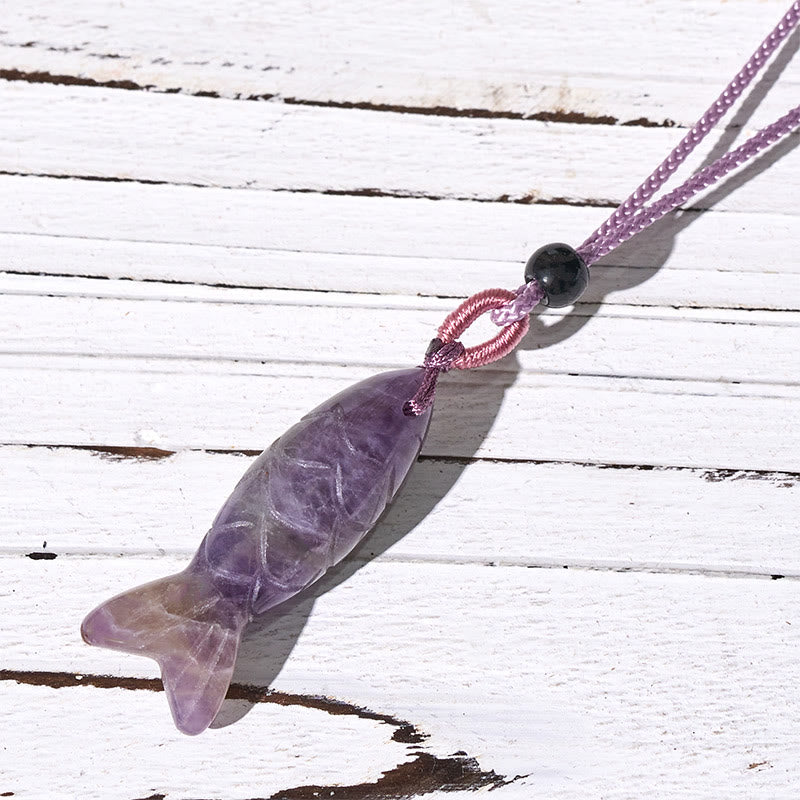 Koi Fish Crystal Necklace Pendant – purple amethyst koi fish on weathered wood diagonal, gemstone pendant