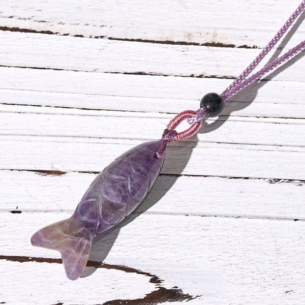Koi Fish Crystal Necklace Pendant – purple amethyst koi fish on weathered wood diagonal, gemstone pendant