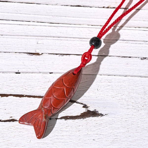 Koi Fish Crystal Necklace Pendant – amethyst pendant on white with purple cord detail, crystal fish necklace