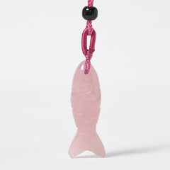 Koi Fish Crystal Necklace Pendant – pink crystal fish pendant close-up showing carved scale texture, gemstone