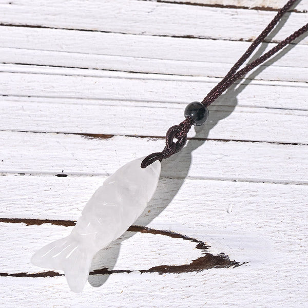 Koi Fish Crystal Necklace Pendant – white clear translucent koi pendant on weathered wood, clear quartz fish