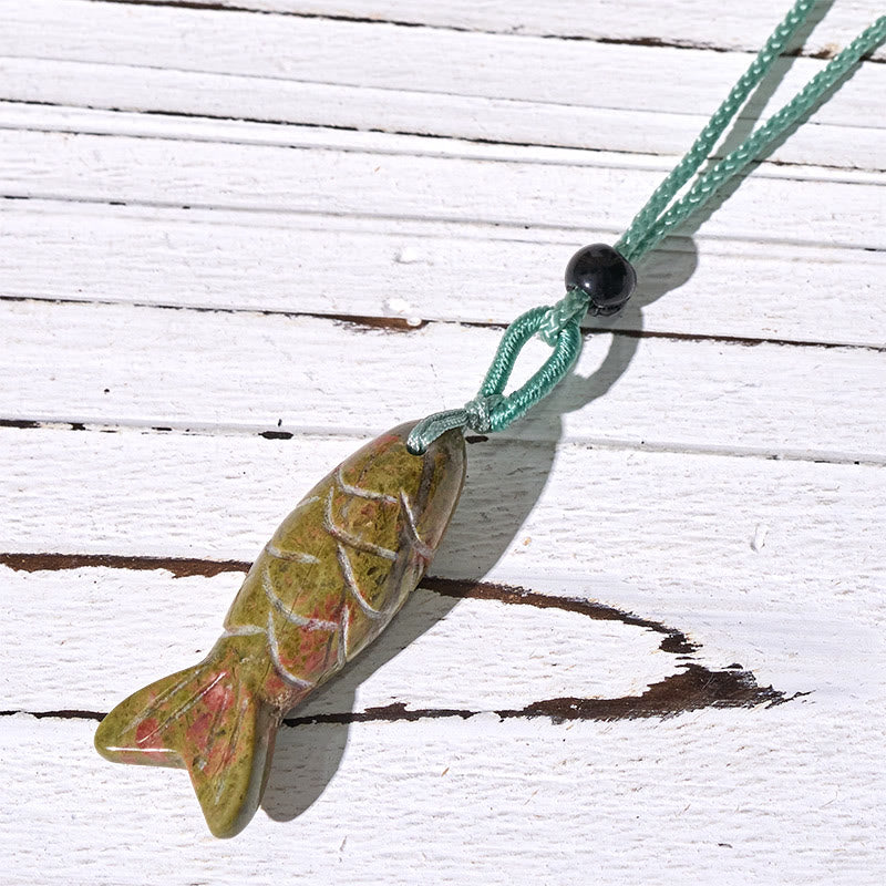 Koi Fish Crystal Necklace Pendant – green agate pendant worn with sage green cord visible, aventurine jewelry