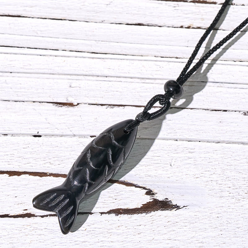 Koi Fish Crystal Necklace Pendant – pink crystal pendant on white showing translucency, rose quartz koi