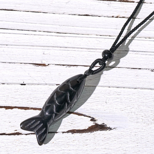Koi Fish Crystal Necklace Pendant – pink crystal pendant on white showing translucency, rose quartz koi