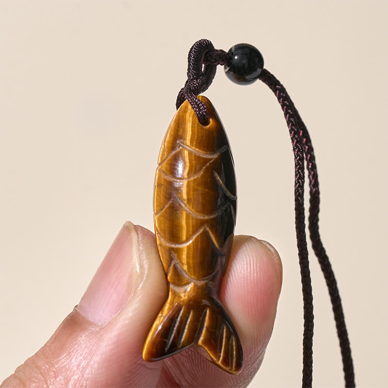 Koi Fish Crystal Necklace Pendant – green Indian agate pendant on white showing moss inclusions, gemstone