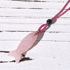 Koi Fish Crystal Necklace Pendant – pink rose quartz koi on weathered wood diagonal, carved fish pendant