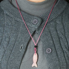 Koi Fish Crystal Necklace Pendant – rose quartz koi fish on pure white frontal view, pink crystal pendant