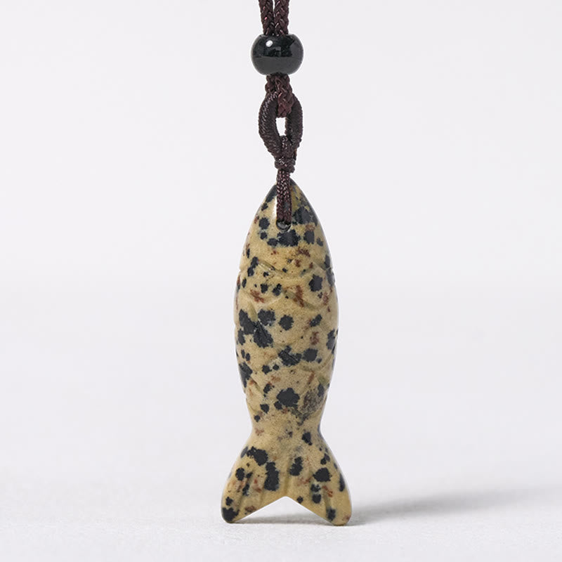 Koi Fish Crystal Necklace Pendant – white clear crystal koi pendant on weathered wood, translucent gemstone