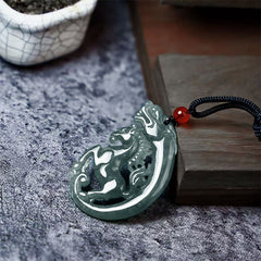 Jade Dragon Horse Necklace – translucent jade dragon carving with red bead and black cord, Luck
