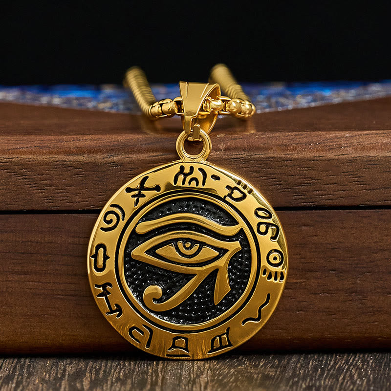 Gold Titanium Necklace – Gold Egyptian eye pendant with black background on stacked wood, chain detail