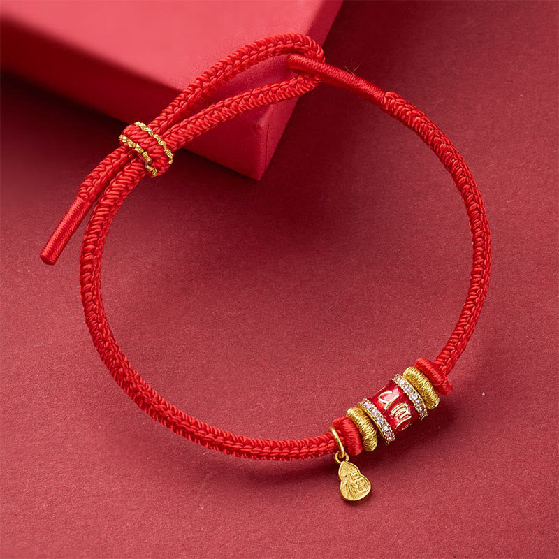 Fu Character Mantra Bracelet – red braided cord with gold barrel bead, crystal accents and dangling charm, three-quarter view, lucky bracelet